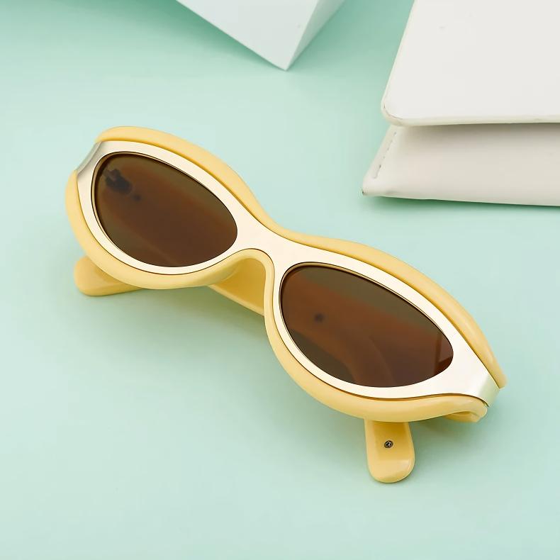 Yoko | Futuristische Ovale Zonnebril met Metaalaccenten